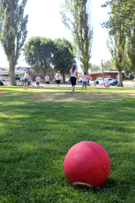red kickball on green field